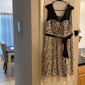 White lace knee length dress with black underneath